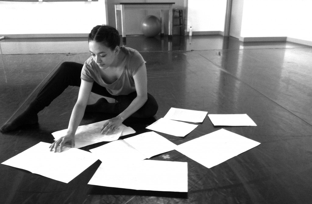 Hubbard Street 2 Apprentice Adrienne Lipson reviews notes in a rehearsal at the Hubbard Street Dance Center, for collaboratively devised choreography to “In C” by composer Terry Riley. Photo by Andrea Thompson.